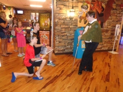 Getting knighted after their quest at Great Wolf Lodge.